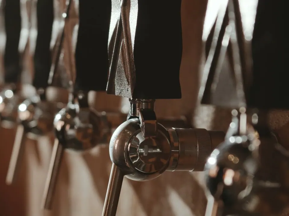 Working row of brewpub taps ready for a lineup change