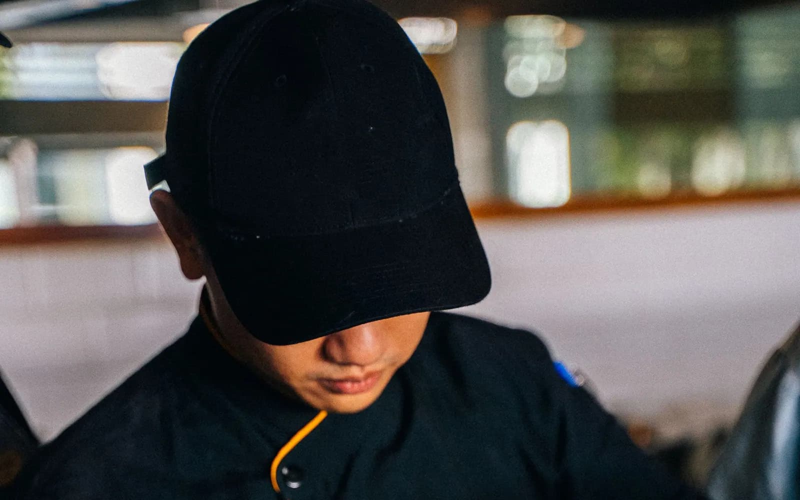 Chef finishing a seasonal plate at the service pass